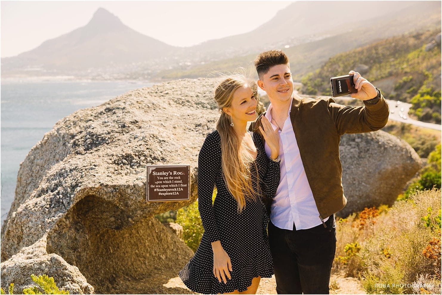 couple taking a selfie after proposal at 12 apostles hotel
