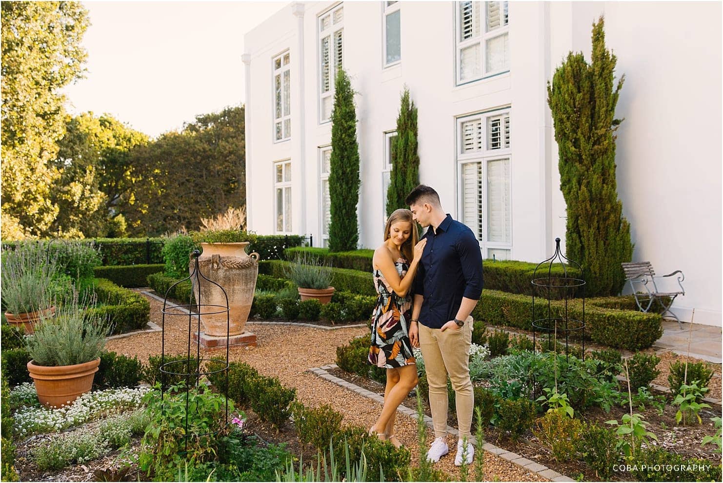 couple in garden at alphen boutique hotel