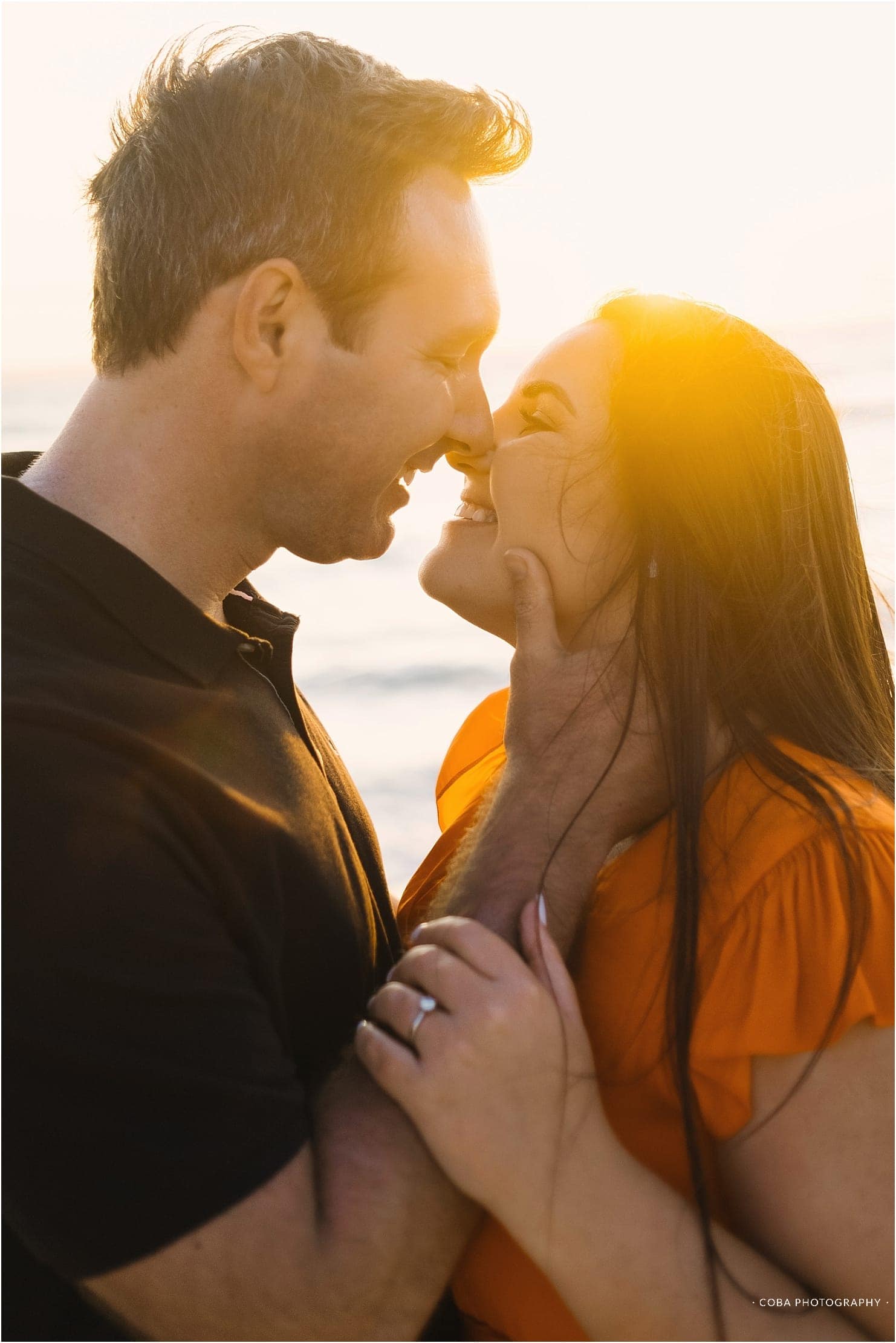 couple kissing on beach langebaan
