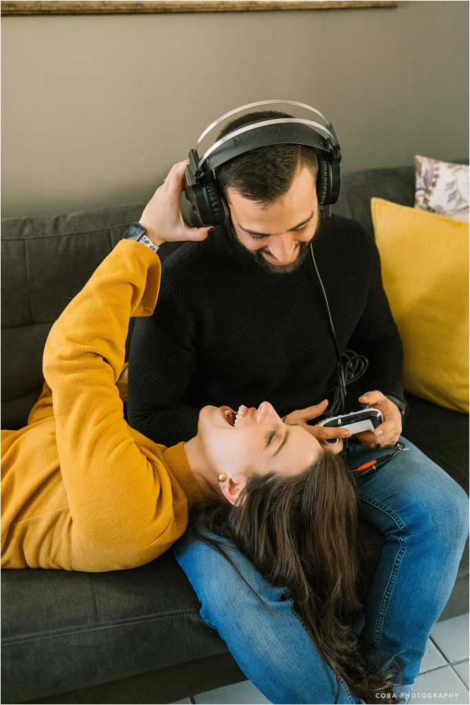 couple playing play station - home couple shoot cape town