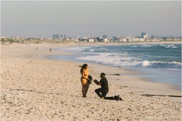 surprise proposal in cape town on dolphin beach