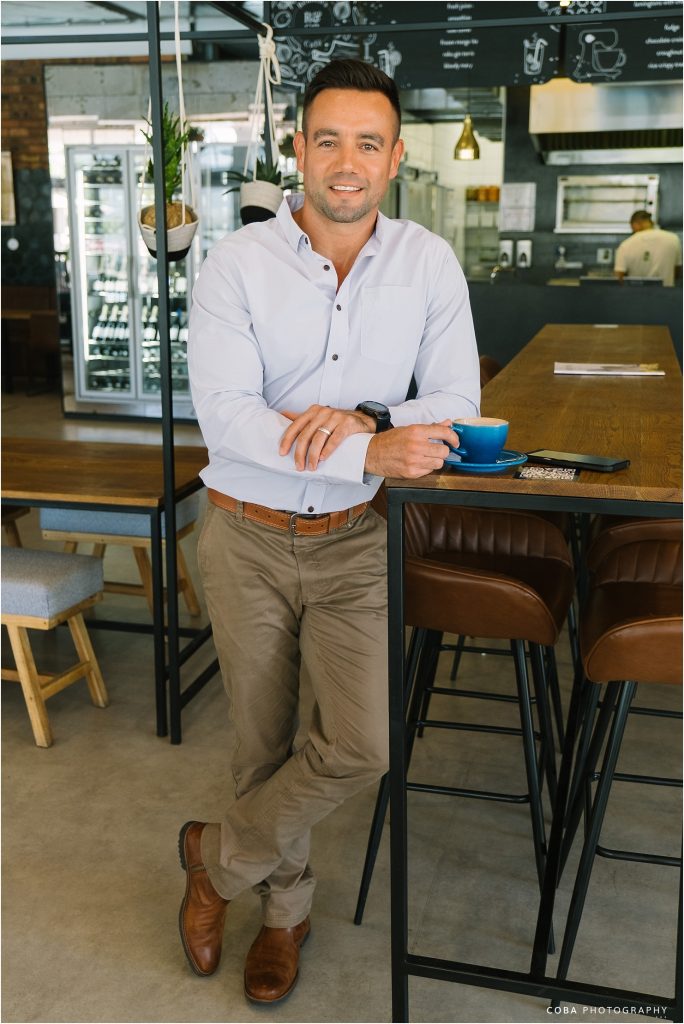Branding Photoshoot in Paarl - insurance broker having coffee at reubens co