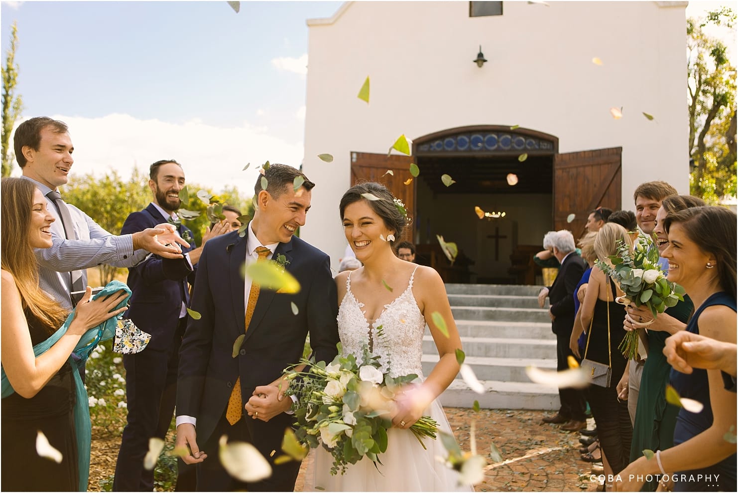wedding at zorgvliet - couple walking through confetti