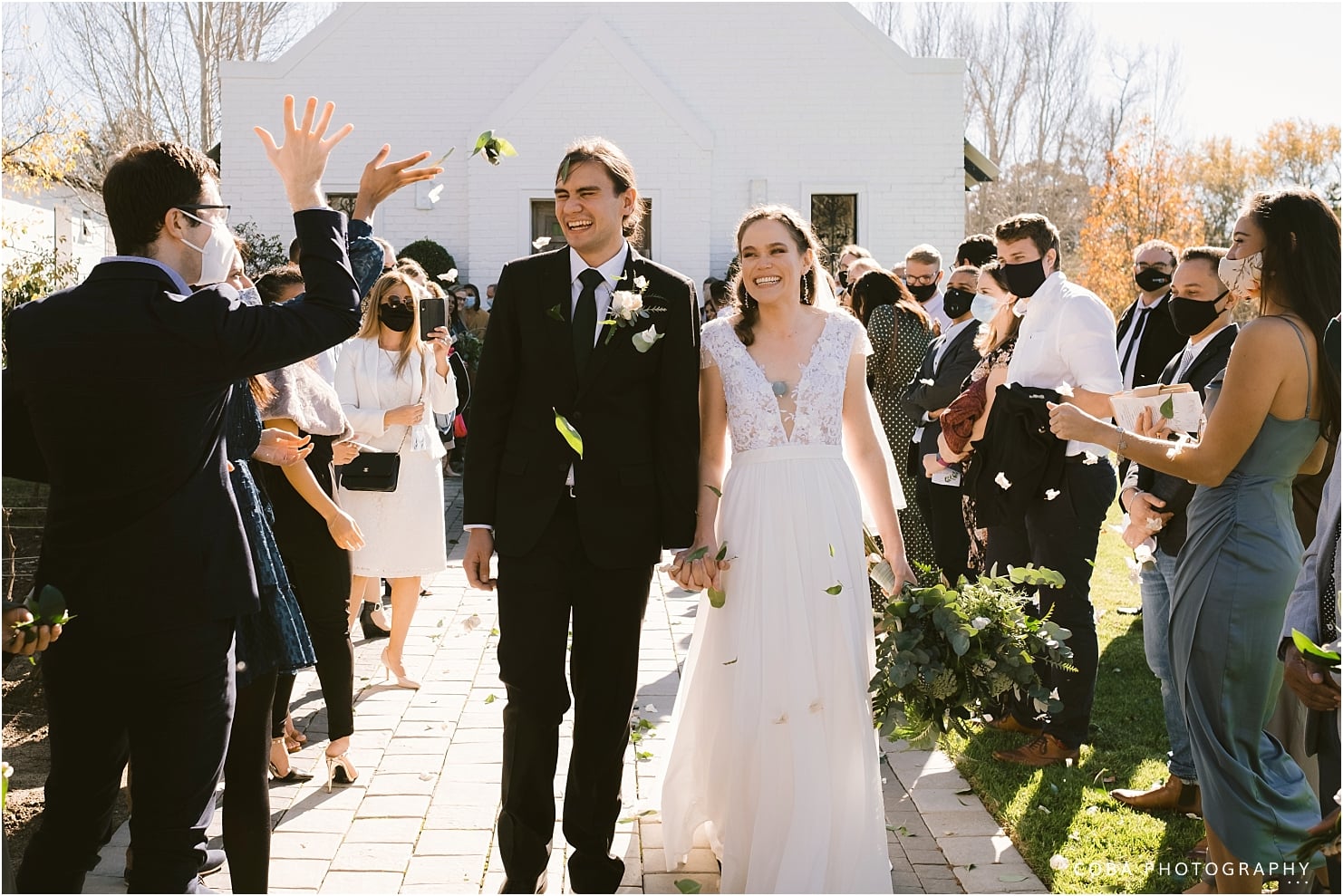 brenaissance wedding - couple walking through confetti