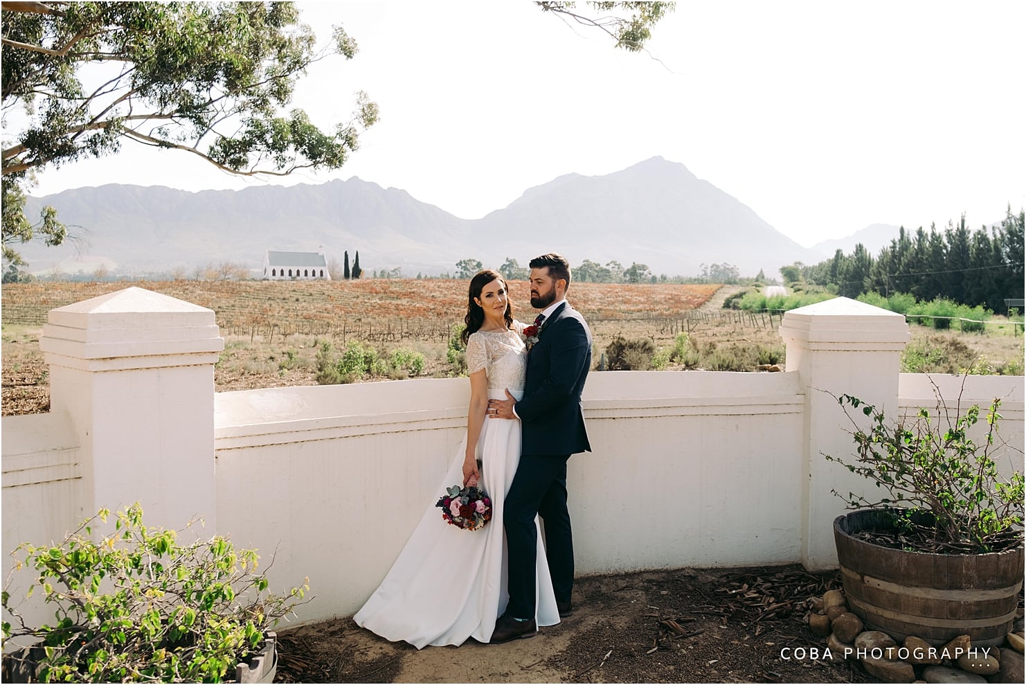 montpellier wedding tulbagh - couple with chapel in the distance