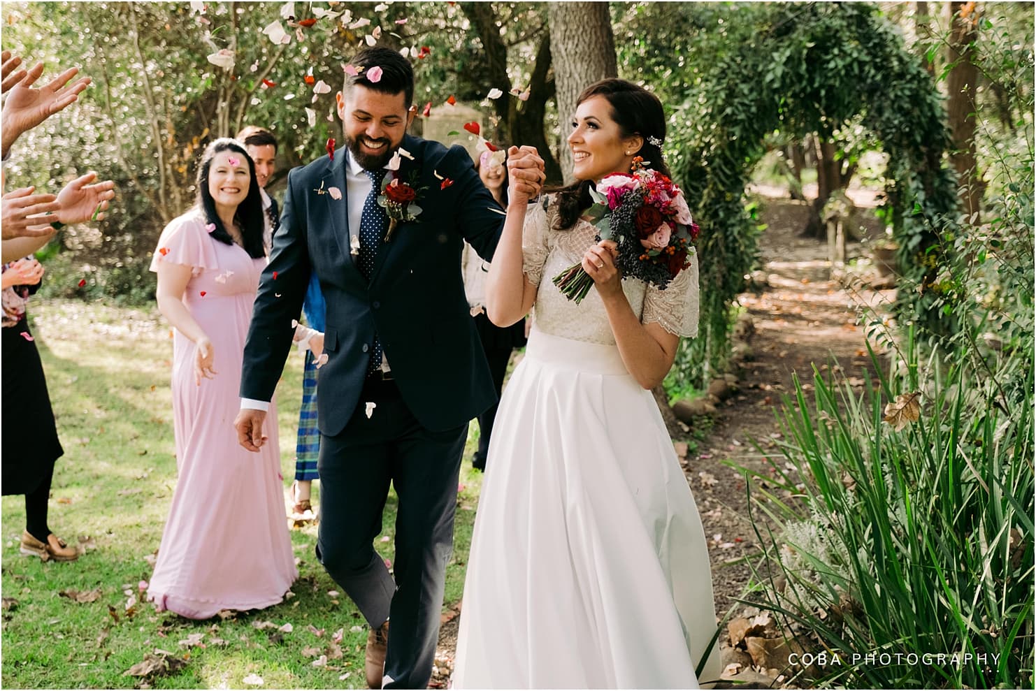 montpellier wedding tulbagh - bride and groom walking through confettie