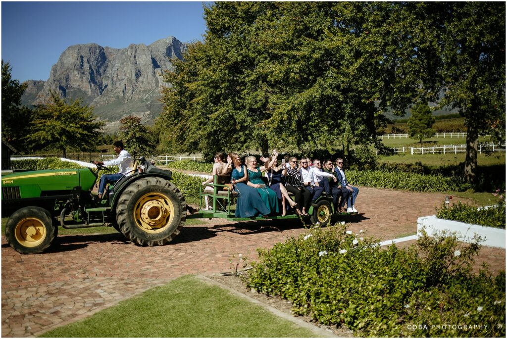 wedding at zorgvliet- guests arriving on tracktor