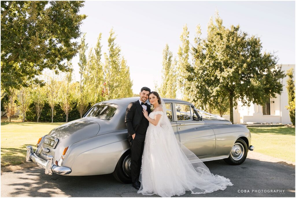 loch lynne wedding couple with wedding car