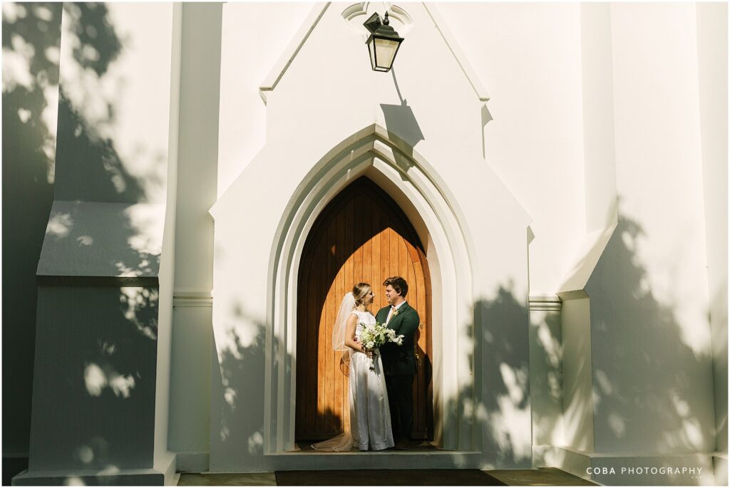 alluvia wedding venue - couple infront of stellenbosch moederkerk ng 