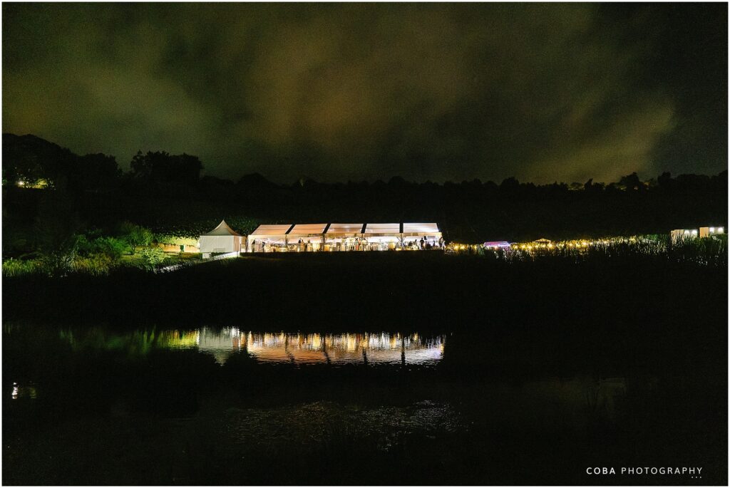 alluvia wedding venue - night time photo of venue at dam - boutique winery stellenbosch