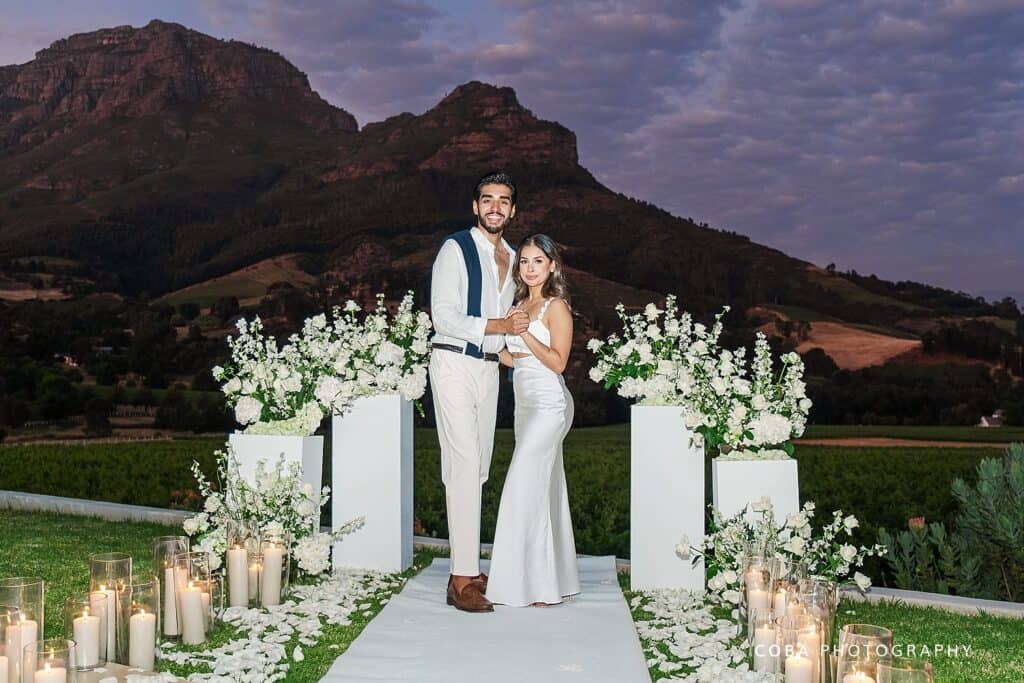 night time photo with candles at proposal setup by Dearest Proposals at Banhoek lodge