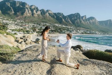 A romantic Maiden's Cove sunset proposal in Cape Town with the Twelve Apostles mountains in the background.
